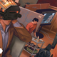 A man with a camera on his head in an office